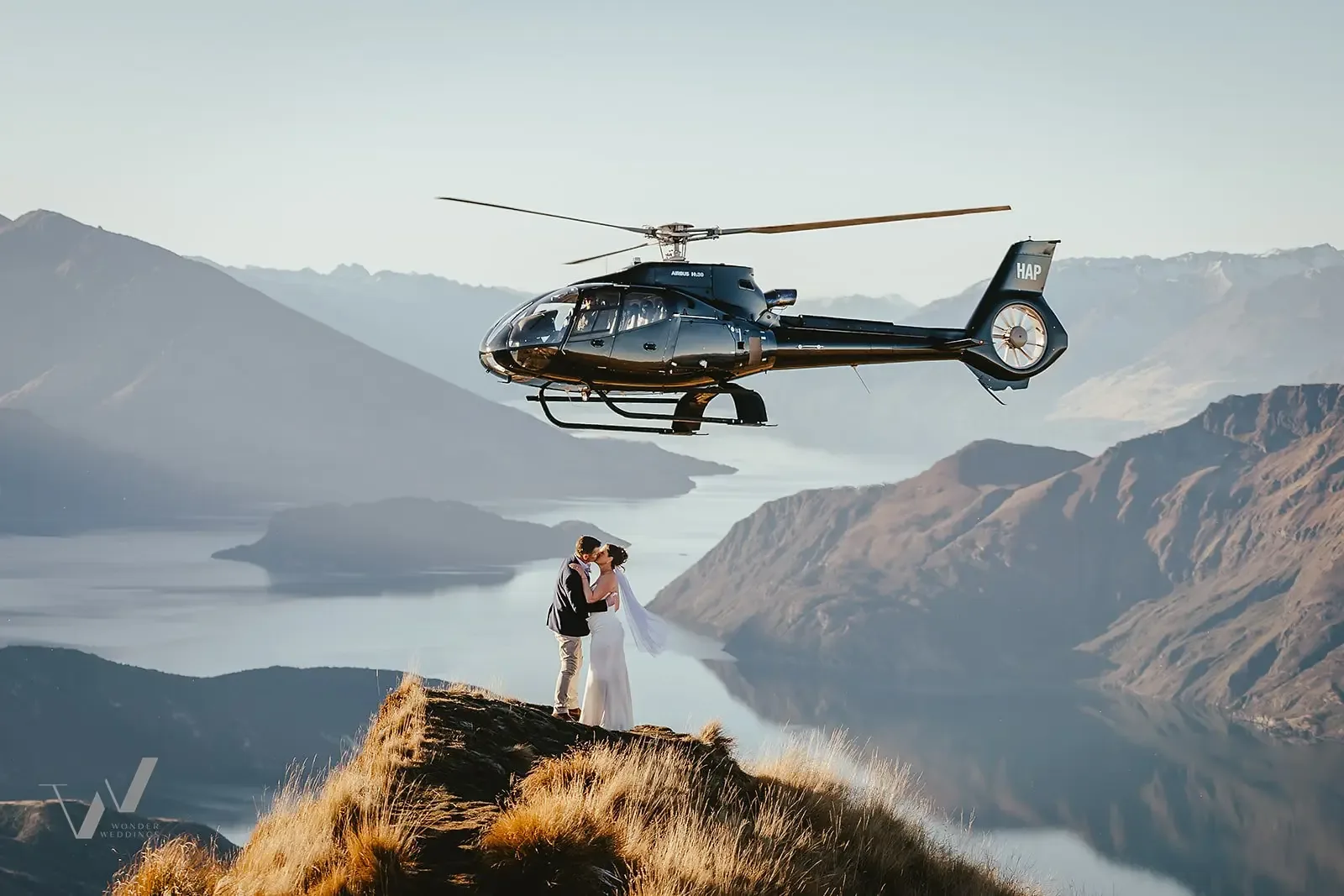 Helicopter flying past the ridge during an elopement