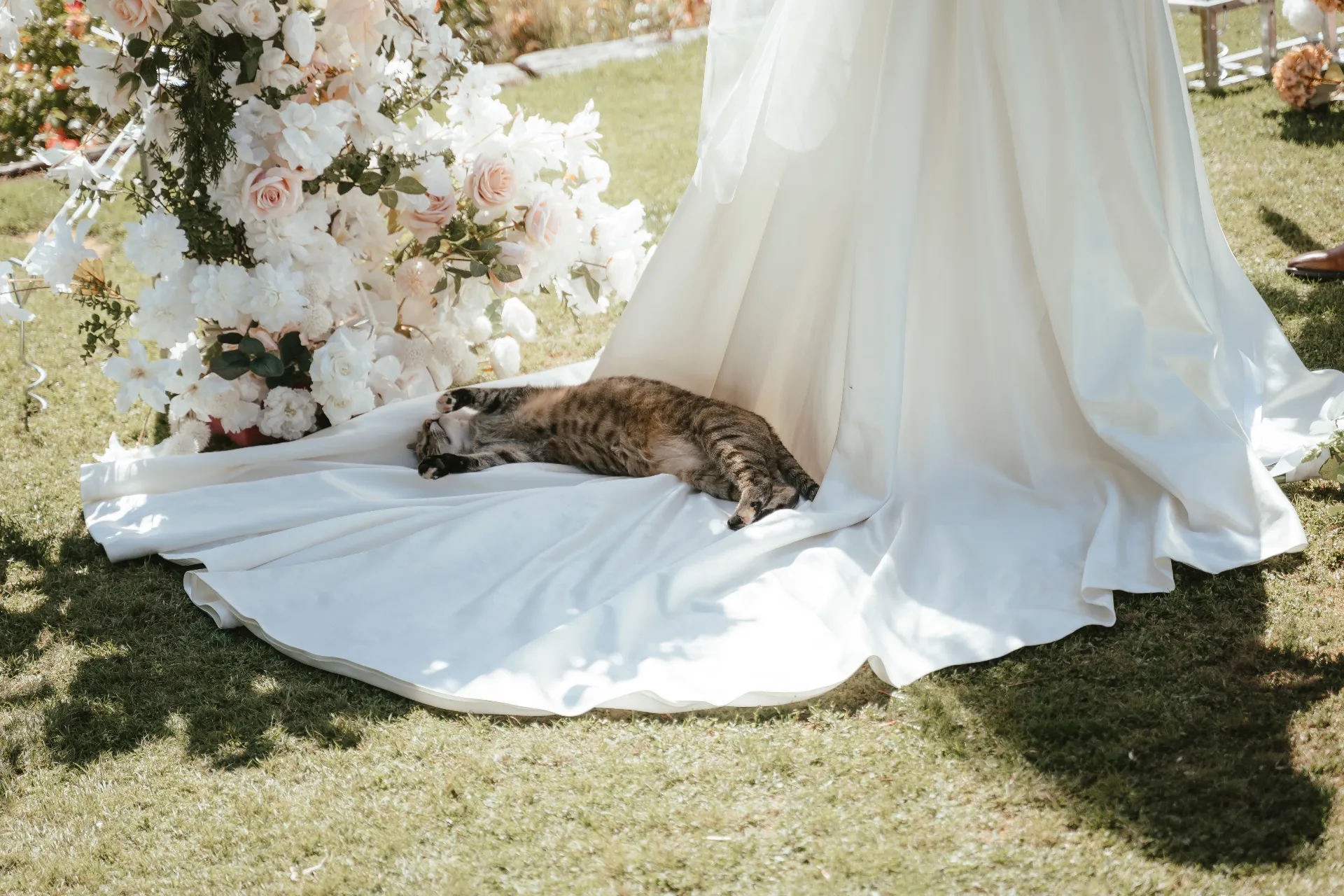 Bride beside a floral arch at a Wānaka garden wedding