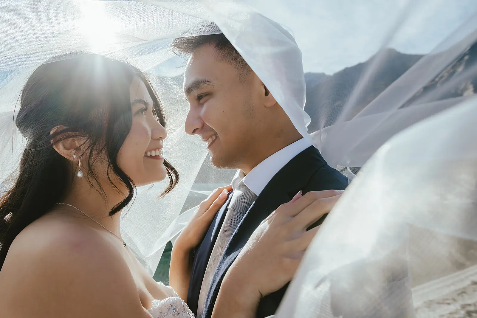 Close-up veil portrait with sun flare